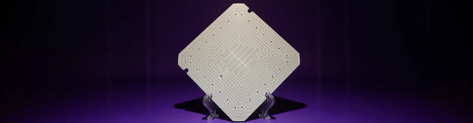 square metal plate with holes drilled out