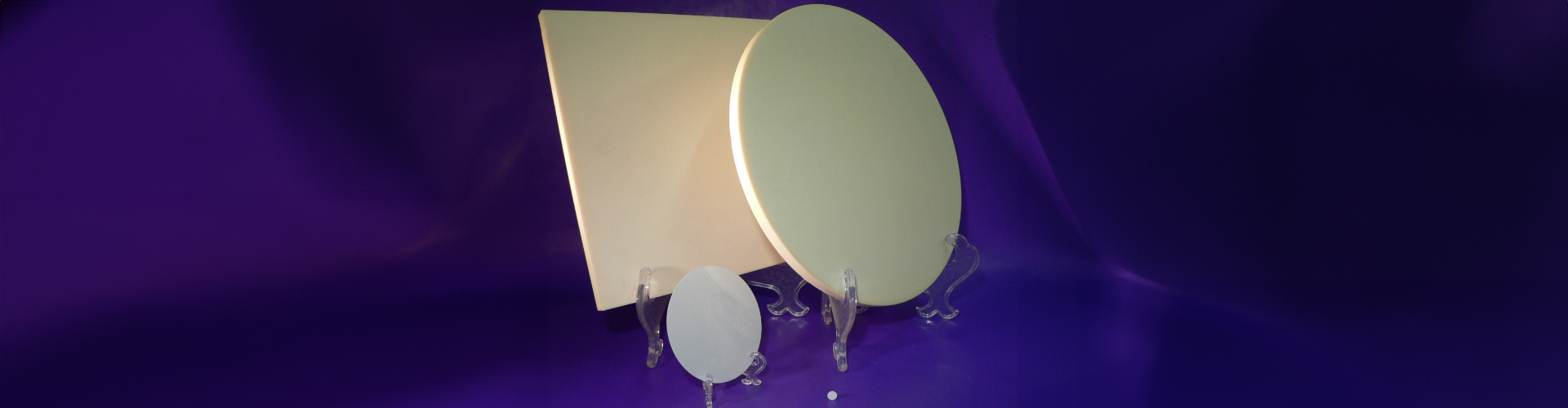 three various ceramic parts and wafers